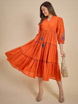 Women Orange Solid Tiered Dress with Tassel Detail